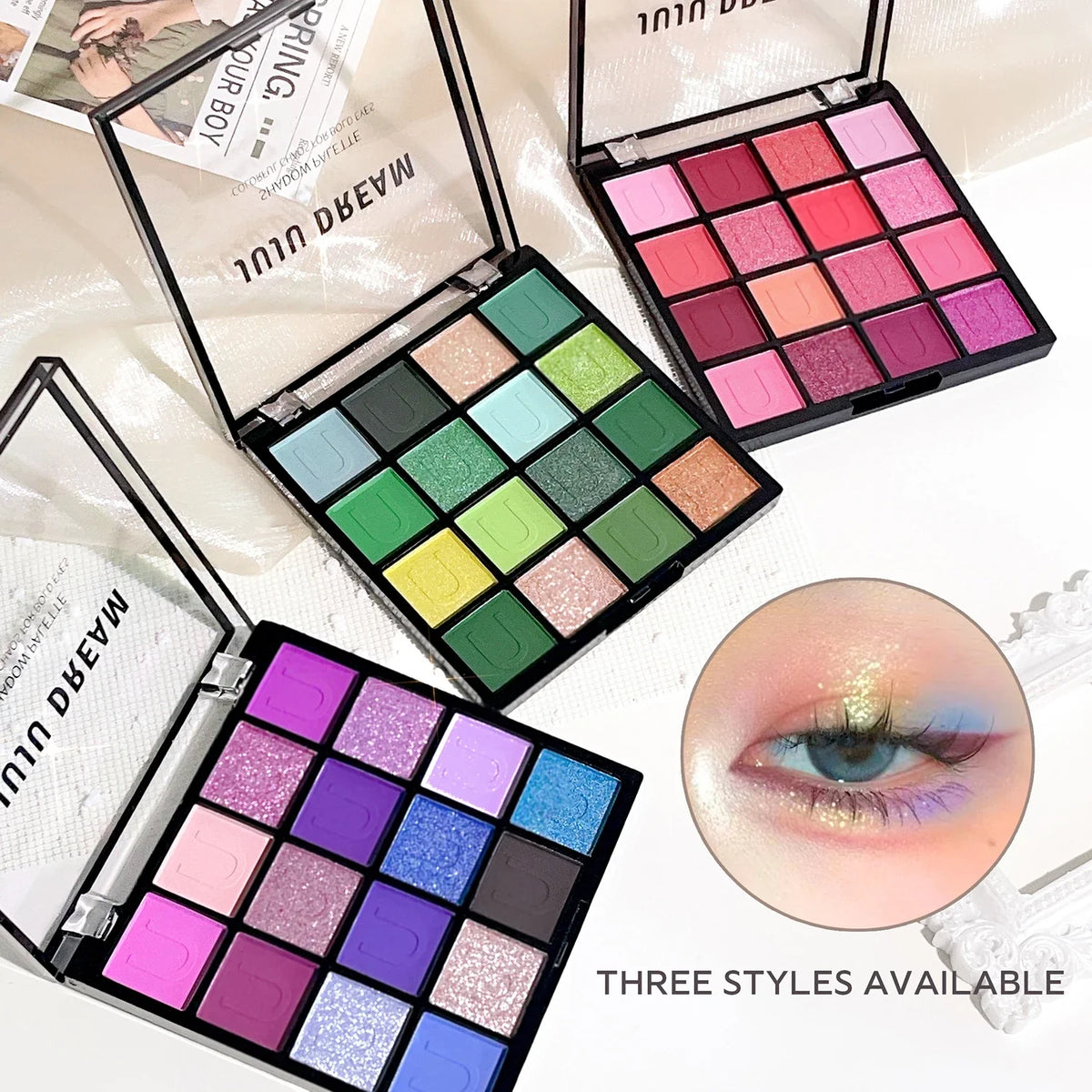 16-Color Eyeshadow Palette: Koi, Mermaid, Enchanted Forest, with pearlescent, matte, and fine shimmer finishes.