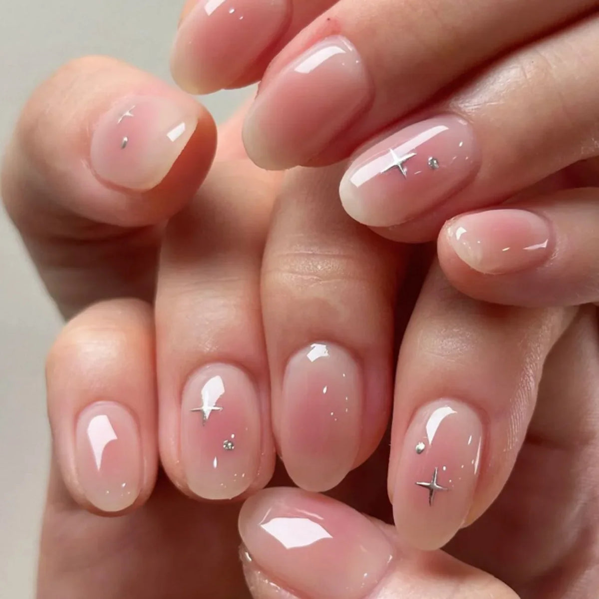 24Pcs Short Oval Head Blush Pink Press on Nails with Simple Designs Almond Nails Wearable Acrylic Full Cover Nail Tips with Glue